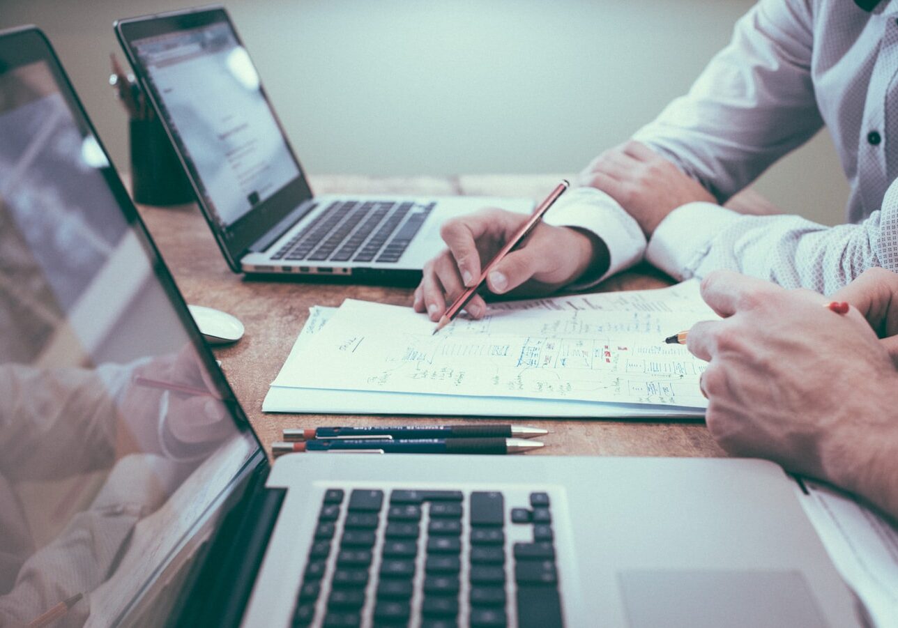 Worker writing down an email marketing strategy